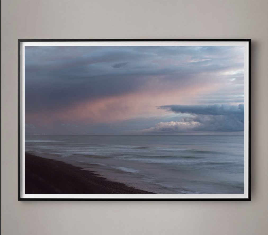dramatic cloud cover over ocean photograph