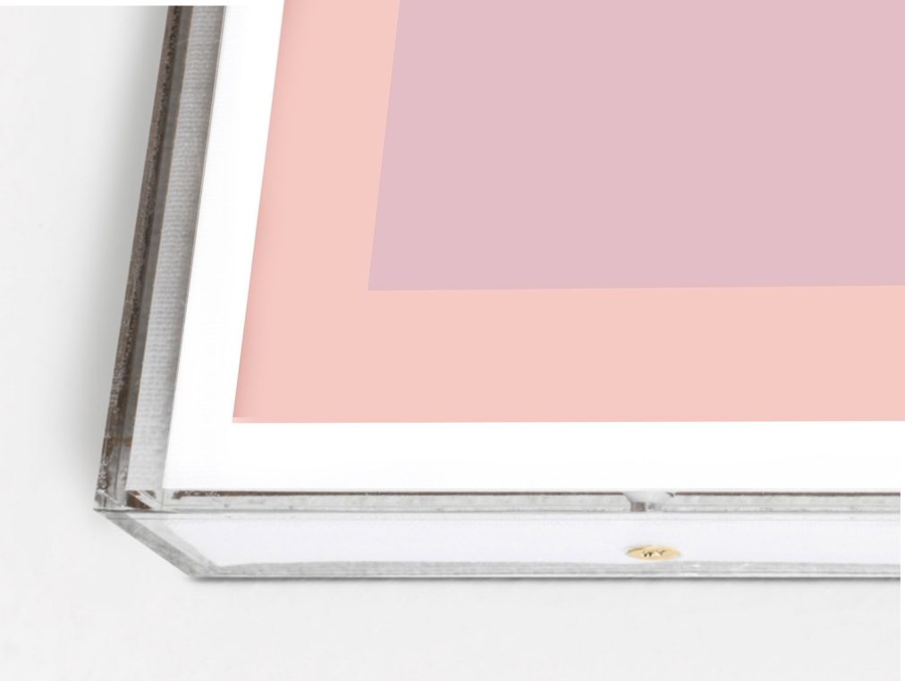 pink geometric art in lucite box frame