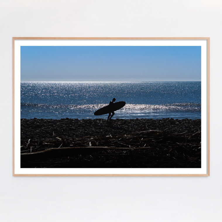 surfer silhouette along the beach photograph